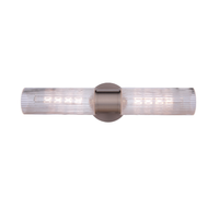 Modern vanity light with double-ended clear ribbed glass cylinders and a satin nickel wall mount for modern bathroom lighting.
