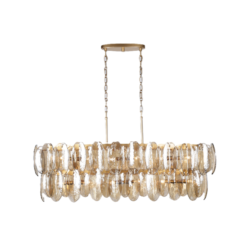 Tiered topaz glass linear chandelier with individually suspended textured glass panels and a warm gold metal frame.