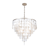 White capiz shell chandelier with cascading round shell discs and champagne-finished metal frame.