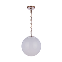 Modern faux alabaster white glass globe pendant light with antique brass finish chain, canopy, and minimalist contemporary design.