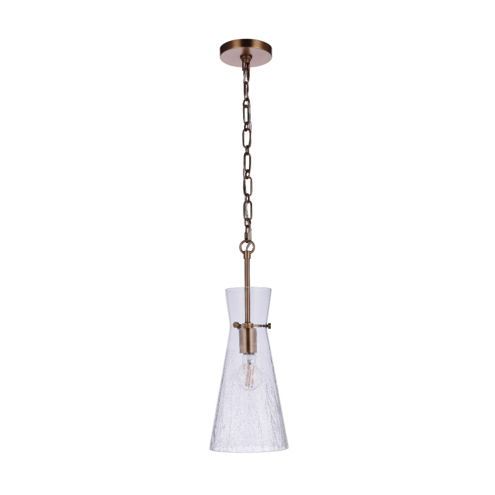 Modern pendant light featuring a handcrafted crackled glass shade, antique brass finished hardware, chain suspension, and exposed Edison-style bulb.