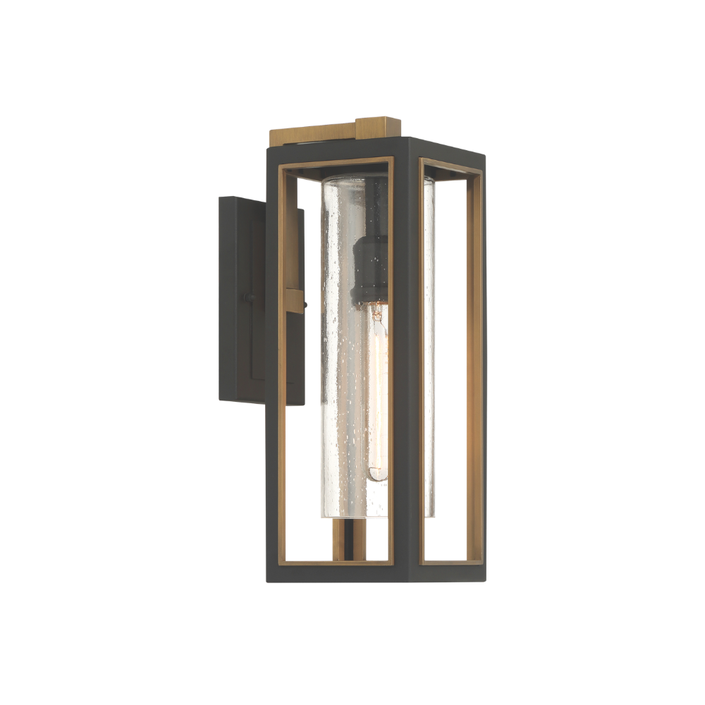 Modern outdoor wall lantern with black frame, brass accents, and seeded glass cylinder shade