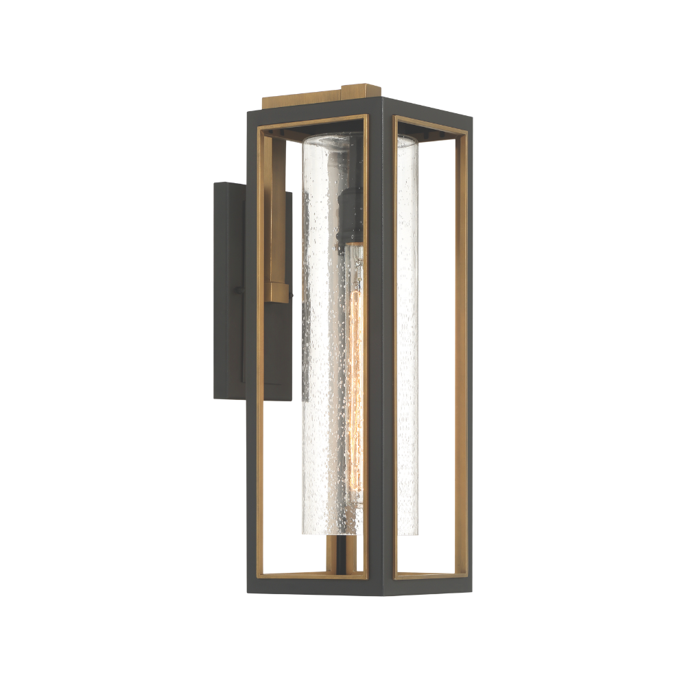 Modern outdoor wall lantern with black frame, brass accents, and seeded glass cylinder shade