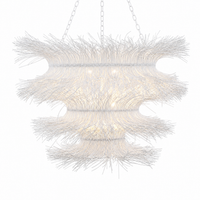 White rattan woven chandelier with layered curl design and soft ambient lighting